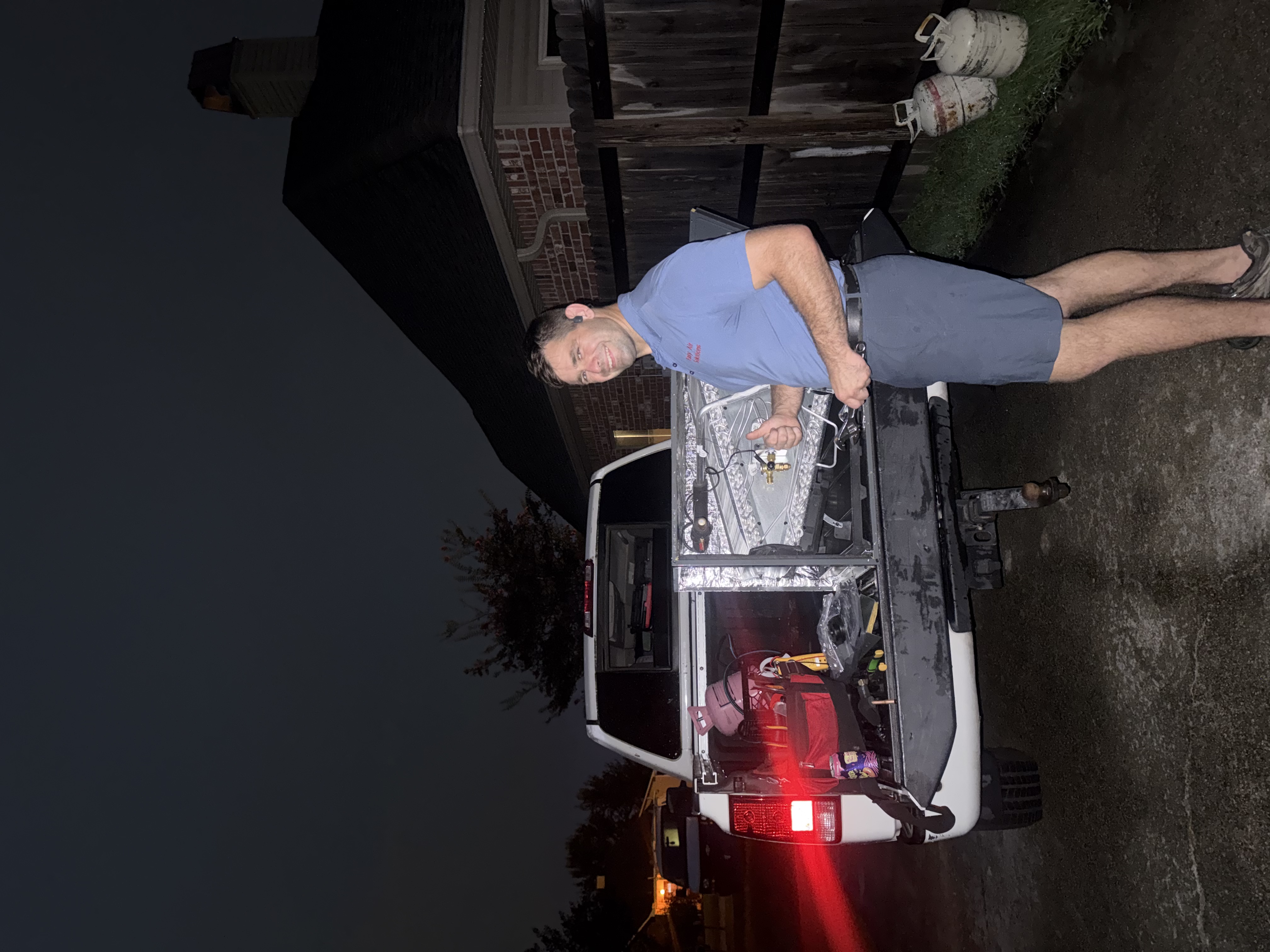 Technician loading a new evaporator coil for installation